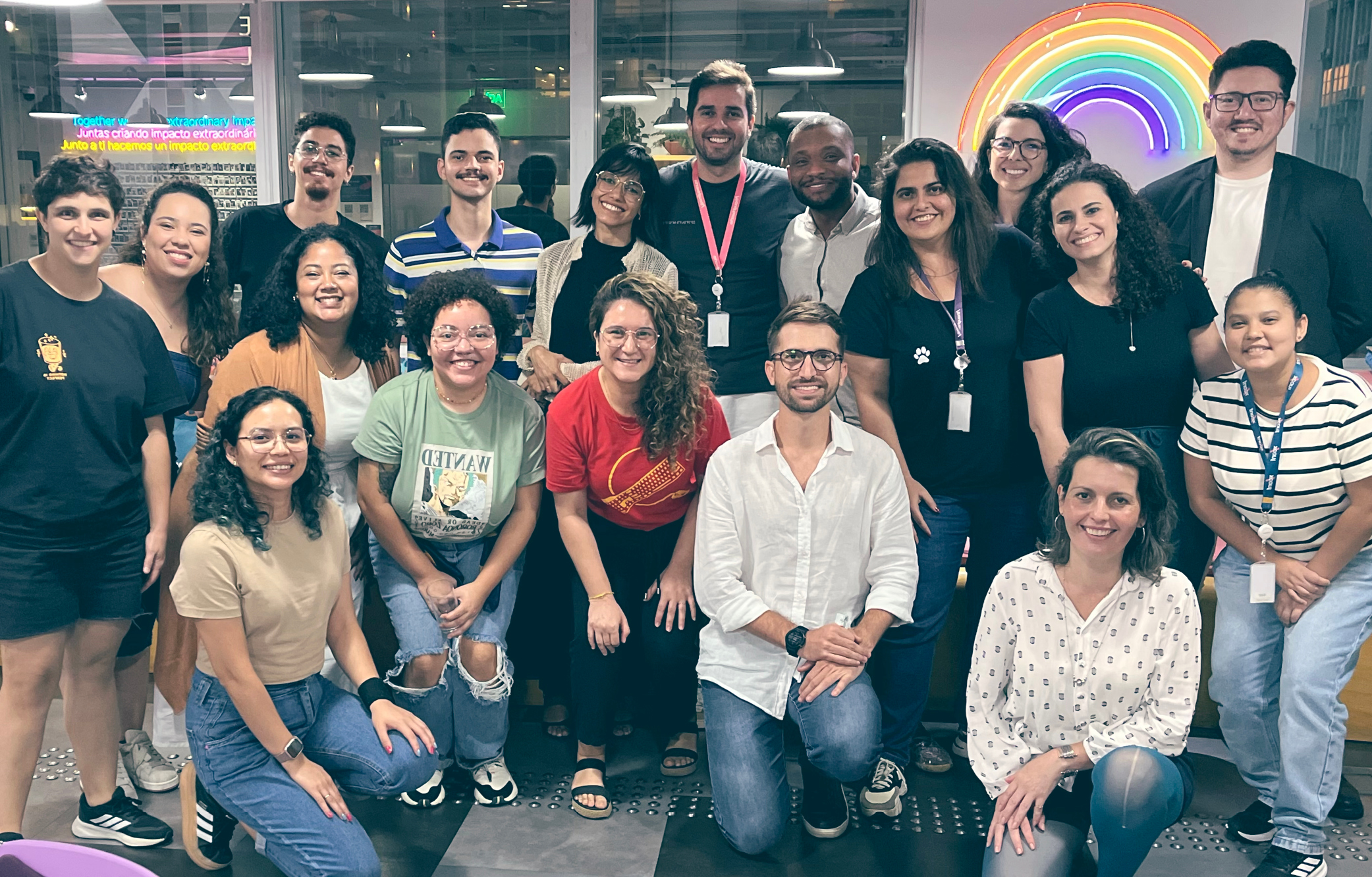 Image of Thoughtworkers gathered in an office for an LGBTQIAPN+ community meeting.